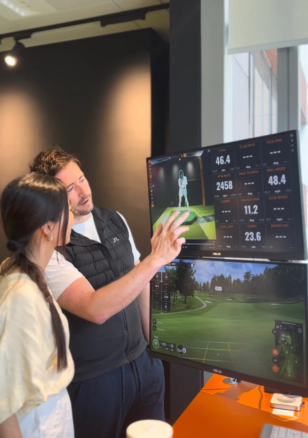 Mike Bygrave reviewing TrackMan swing data with a golfer