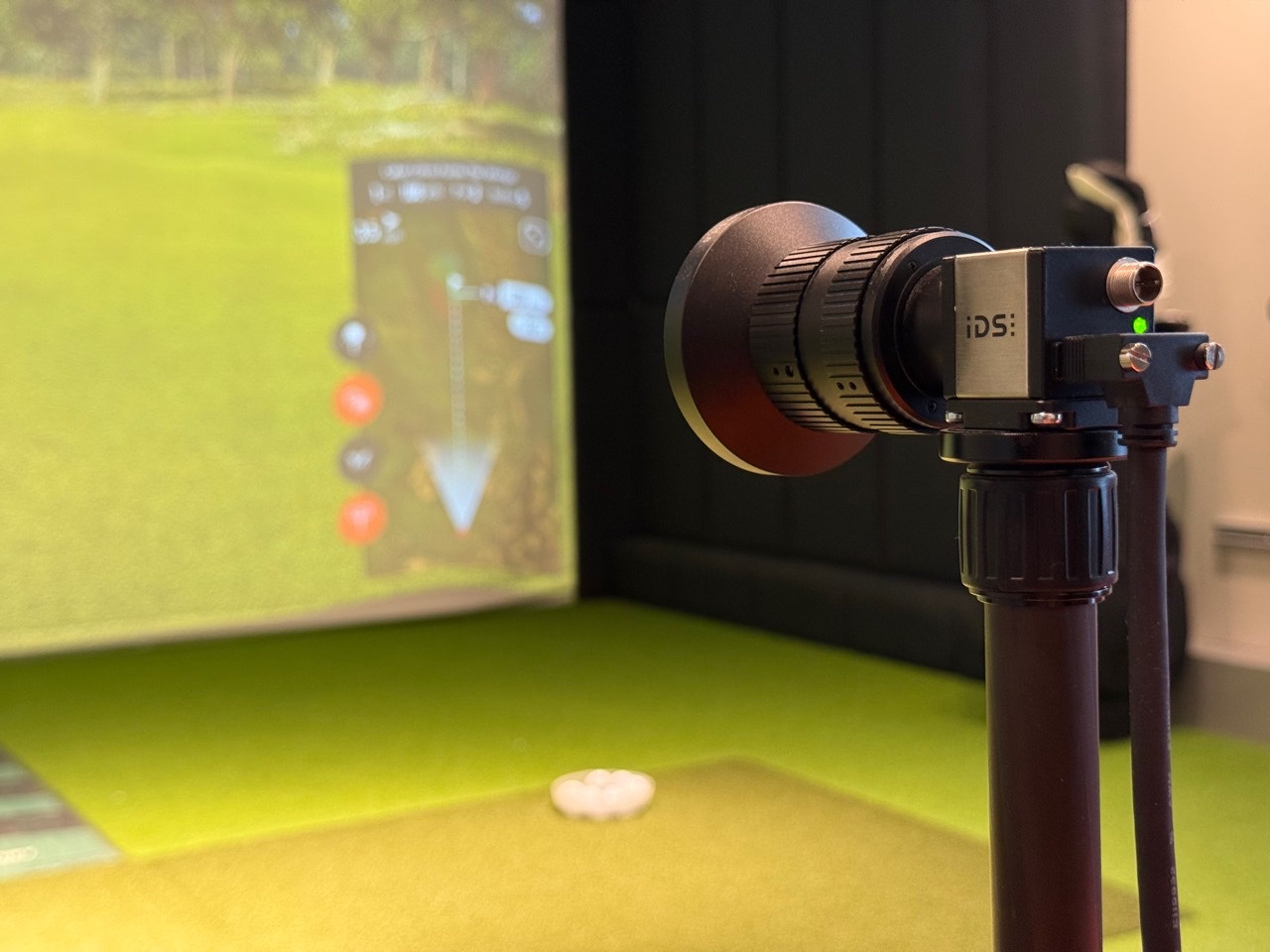 A high-speed swing camera recording inside a TrackMan bay at Shots Factory